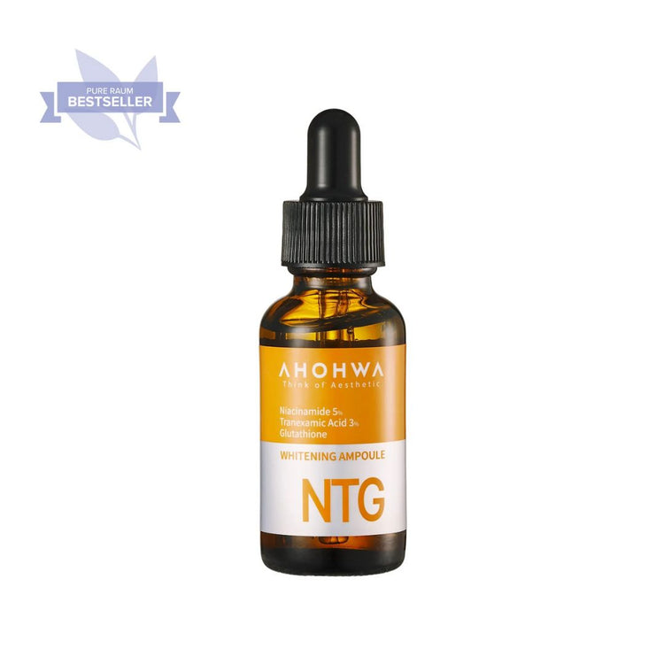 Close-up of NTG Whitening Ampoule bottle with dropper on skincare shelf