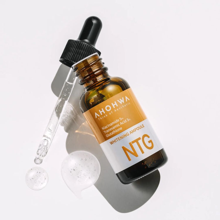 Close-up of NTG Whitening Ampoule bottle with dropper on skincare shelf