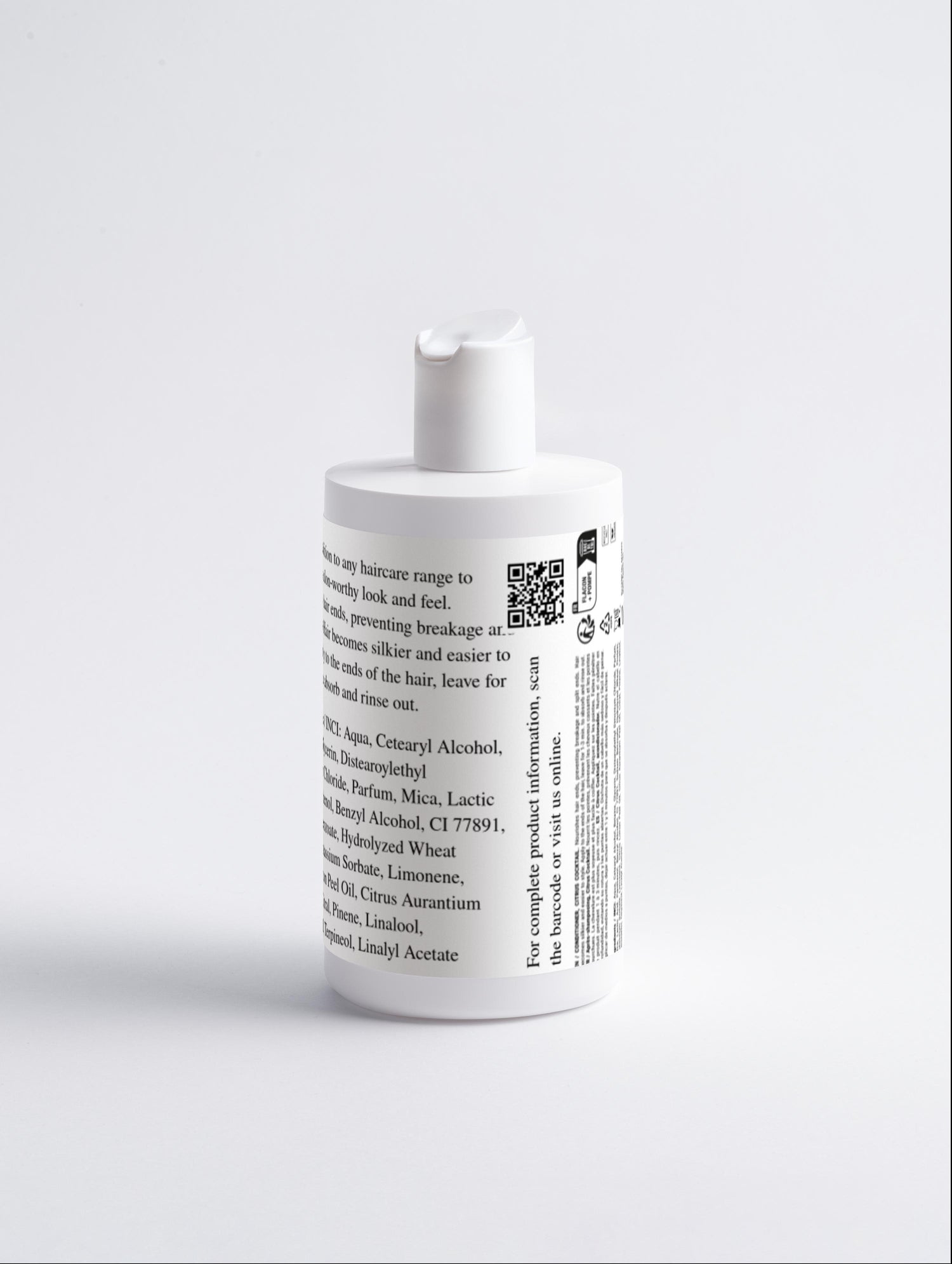White bottle with a label on a light gray background